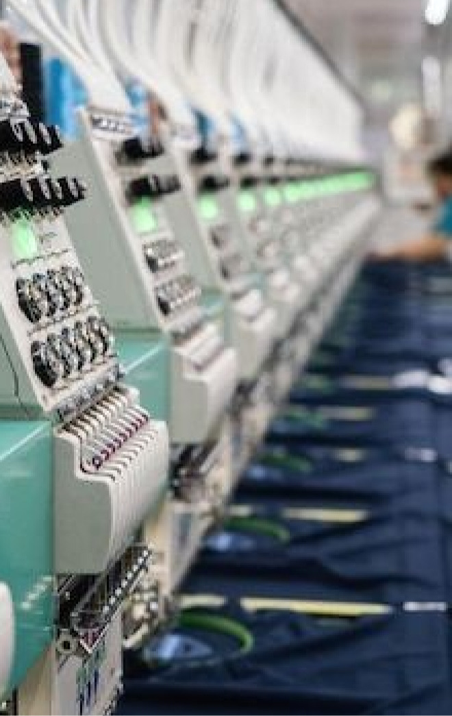 A row of embroidery machines in production